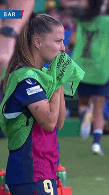 a female soccer player wearing a number 9 jersey
