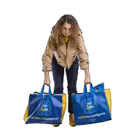 a woman is holding two bags that say euro spin