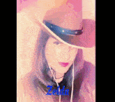 a woman wearing a cowboy hat with the word zelda written on the bottom