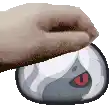 a pixel art of a hand holding a mouse with a cartoon face on it .