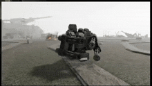 a black and white video game scene with a robot on the ground