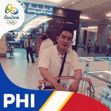 a man pushing a shopping cart in front of a sign that says phi