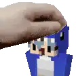 a person is putting a blanket on top of a blue minecraft character .