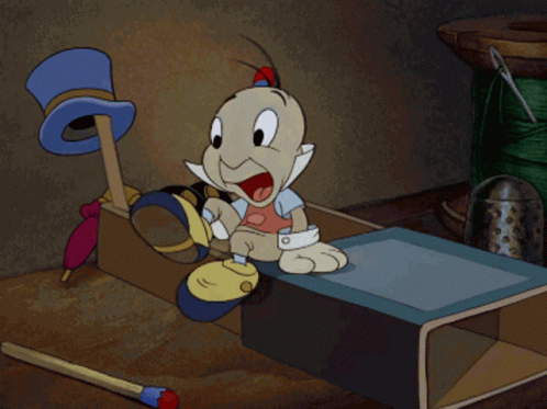 a cartoon character is sitting in a box holding a pair of blue socks