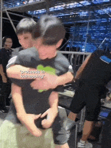 two men hugging with the words proceed in kidnapping on the bottom right