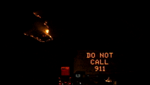a sign that says smoke visible ahead is lit up in the dark