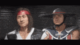 two men are standing next to each other and one has a bandana on his head