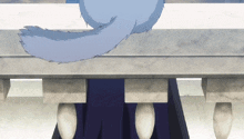 a cat 's tail is hanging over a marble table
