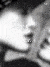 a black and white photo of a person 's face with the word loading on the bottom