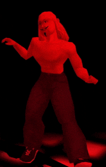 a red cartoon character is standing in the dark with his arms outstretched