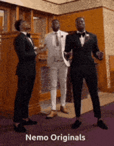 three men in tuxedos are dancing in a room with nemo originals written on the bottom right