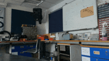 a classroom with a white board that says sorry on it
