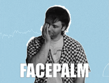 a man wearing a checkered shirt is covering his face with his hand and the word facepalm is on the bottom