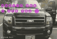 a ford truck is parked in a parking lot with the words " i love you " written on the front