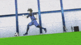 a soccer player in a blue uniform is running towards the ball
