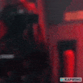 a blurred image with the word kapwing on the bottom left
