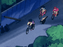 a group of people are riding bikes down a street