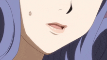 a close up of a woman 's mouth with a tear coming out of her eye