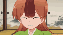 a girl with red hair is making a funny face