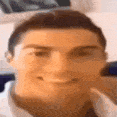 a blurry picture of a man 's face with a slight smile on his face