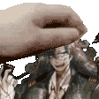 a close up of a person 's hand holding a picture of a man .