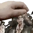 a close up of a person 's hand holding a picture of a man .