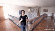 a woman is standing on a staircase with the words made in animotica on the bottom