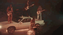 Rocking Out Music Video GIF - Rocking Out Music Video Standing On A Car GIFs