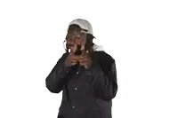 a man with dreadlocks wearing a hat and a jacket with the word columbia on it