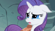 a cartoon pony with purple hair and a white horn is crying