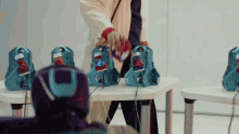 a person in a lab coat is standing in front of a table with a bunch of toys on it