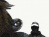 a blurry picture of a man in a baseball cap standing next to a horse .