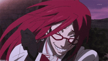 a cartoon character with red hair and glasses is on a screen that says ntv on it