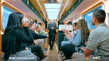 a group of people sitting on a bus with nbc written on the bottom of the screen