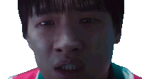 a close up of a man 's face with his mouth open and his teeth visible