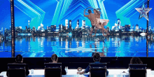 a group of people watching a performance on a stage