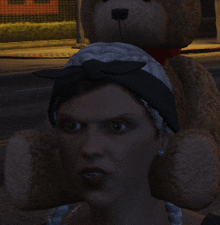 a woman holding a teddy bear on her head