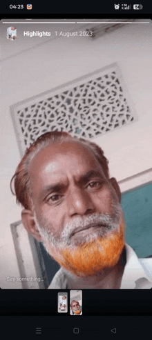a man with an orange beard is on a cell phone screen
