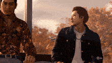 two men are sitting next to each other in a video game with a x on the bottom left