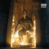 a man is surrounded by lightning and says hbo max in the corner