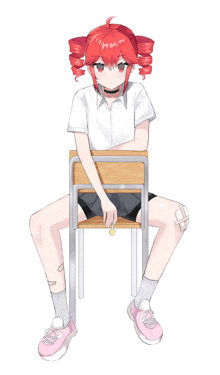 a girl with red hair is sitting on a school desk