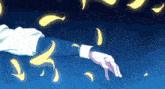 a person 's hand is reaching out towards glowing yellow petals