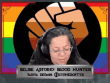 a woman wearing headphones and a sign that says selise astorio blood hunter tanya depass