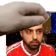 a man with a beard is wearing a red shirt and a white stripe on the sleeves .