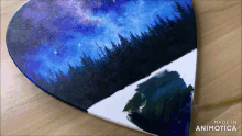 a heart shaped painting with the words made in animotica on it