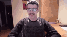 a man wearing a shirt that says unknown on it