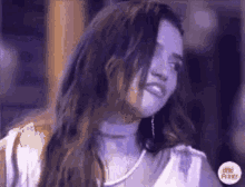 a woman with long hair is wearing a white shirt and a choker .