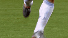 a blurry picture of a soccer player in a yellow jersey and blue shorts