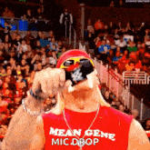 a man wearing a mean gene mic drop shirt