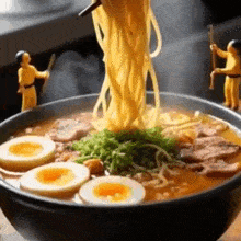 noodles are being poured into a bowl of ramen with eggs and meat
